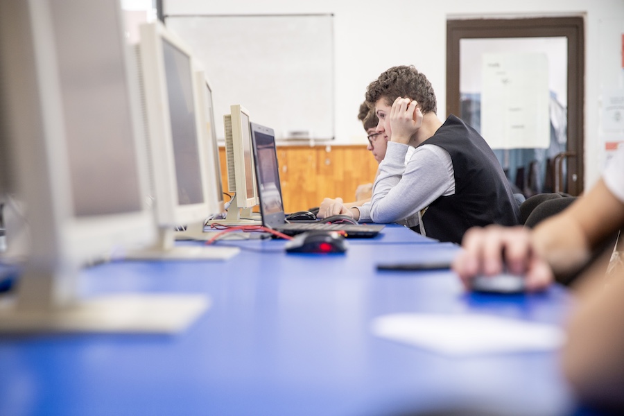 Students use a computer in class.