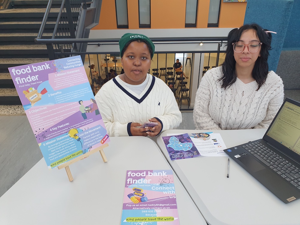 Two young students display their creations at Coolest Projects South Africa.