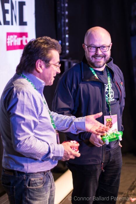 Pete Lomas and Philip Colligan laugh on stage.