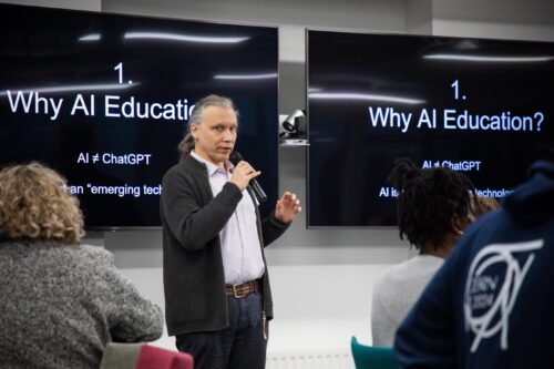 Photo of a researcher presenting at the AI Symposium.