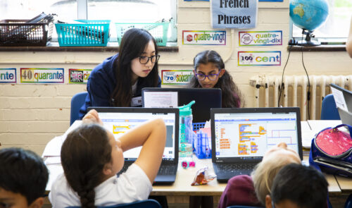 Children at laptops in a primary school.