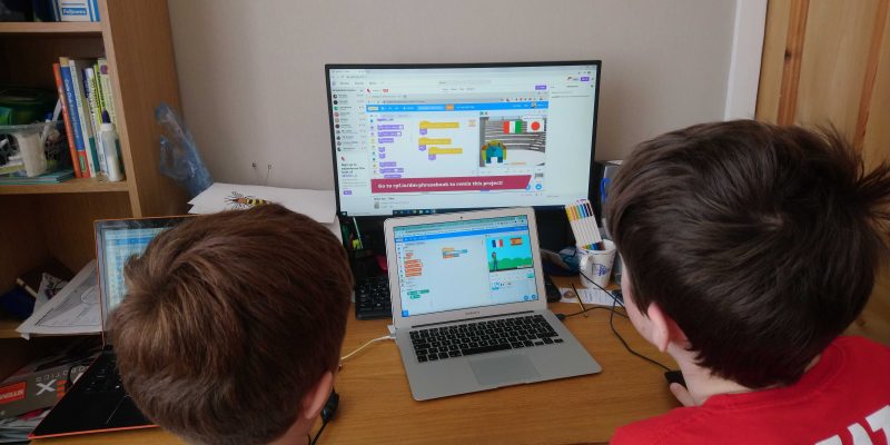 Two kids doing digital making at home