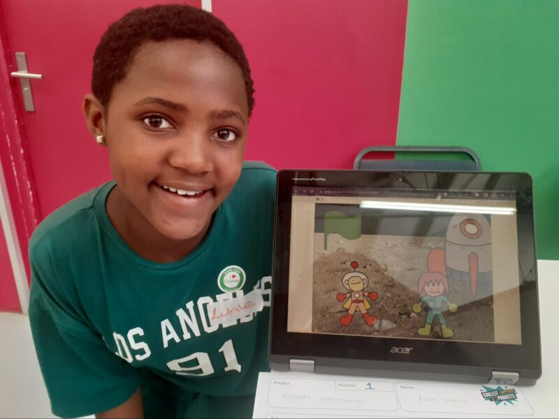 A young tech creator with her Scratch project at Coolest Projects South Africa 2023.