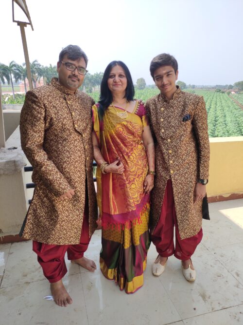 Toshan, an Indian teenager, with his mother and father.