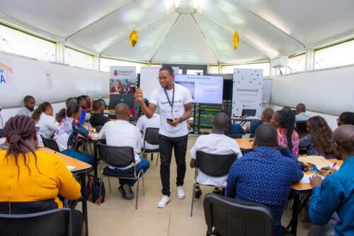 Trainer discussing Experience AI at a teacher training event in Kenya.