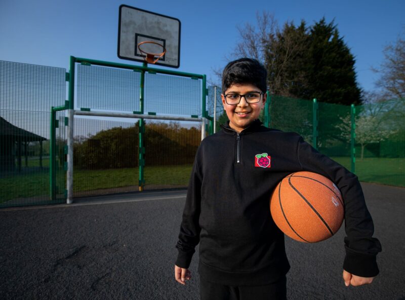 Jay at an outside basketball court.  