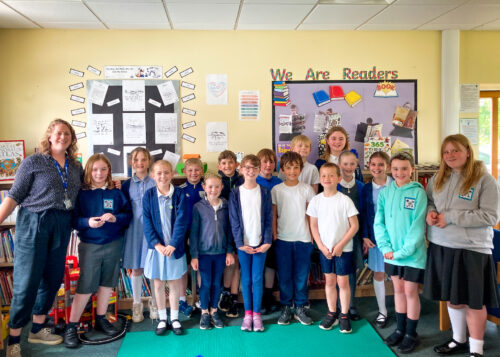 A teacher and her learners at a Code Club session.